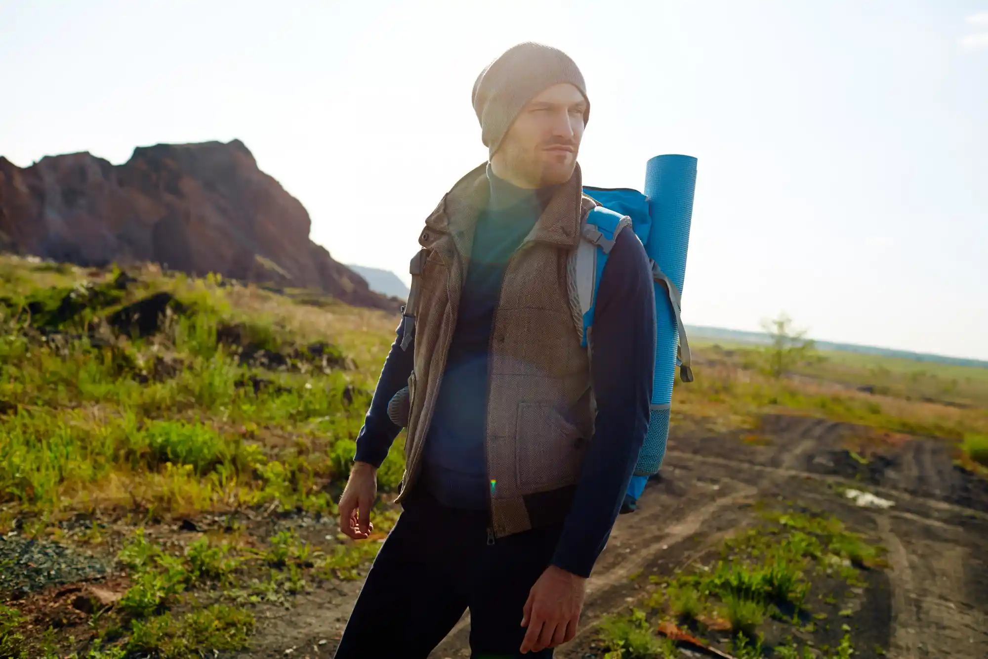 Man rucking with blue backpack