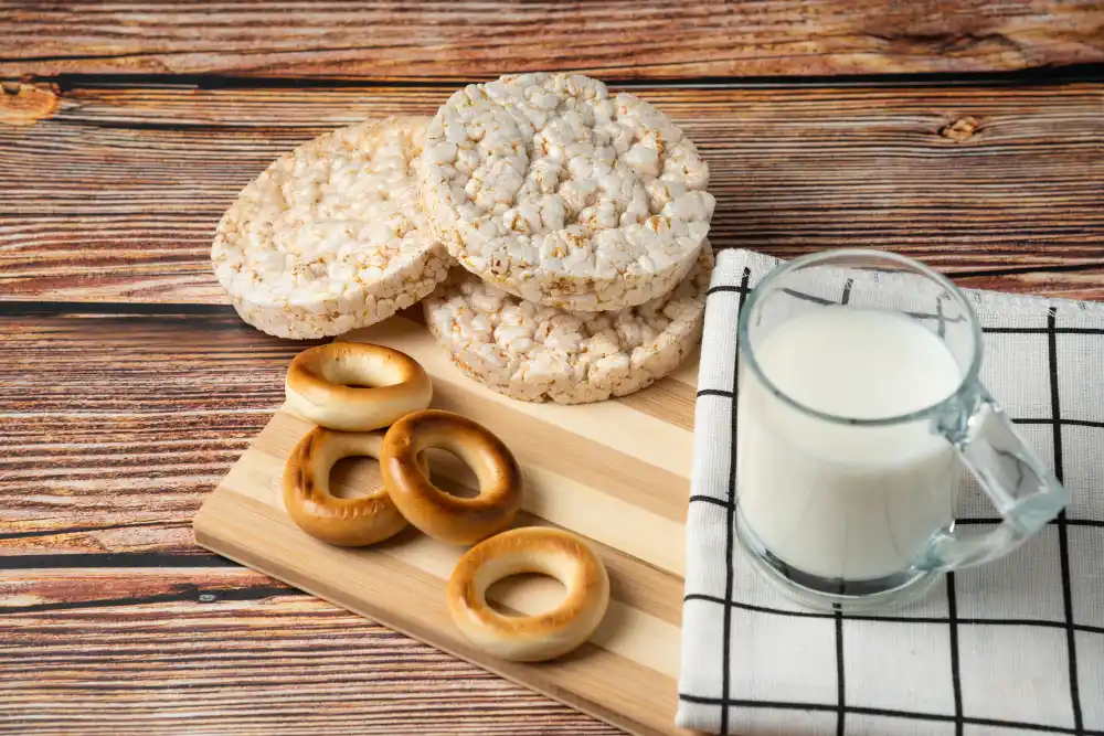 Healthy gluten-free dairy-free snacks including rice cakes and plant-based milk